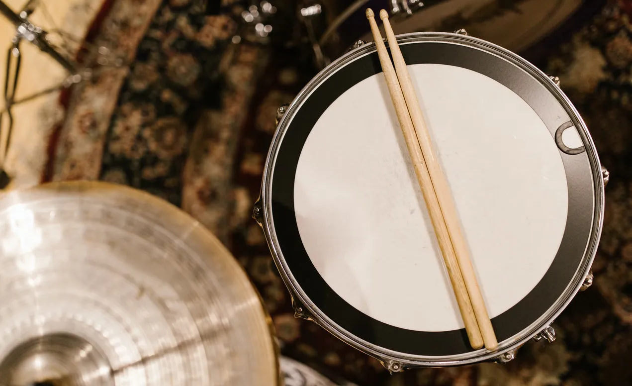 A drum stick and drum