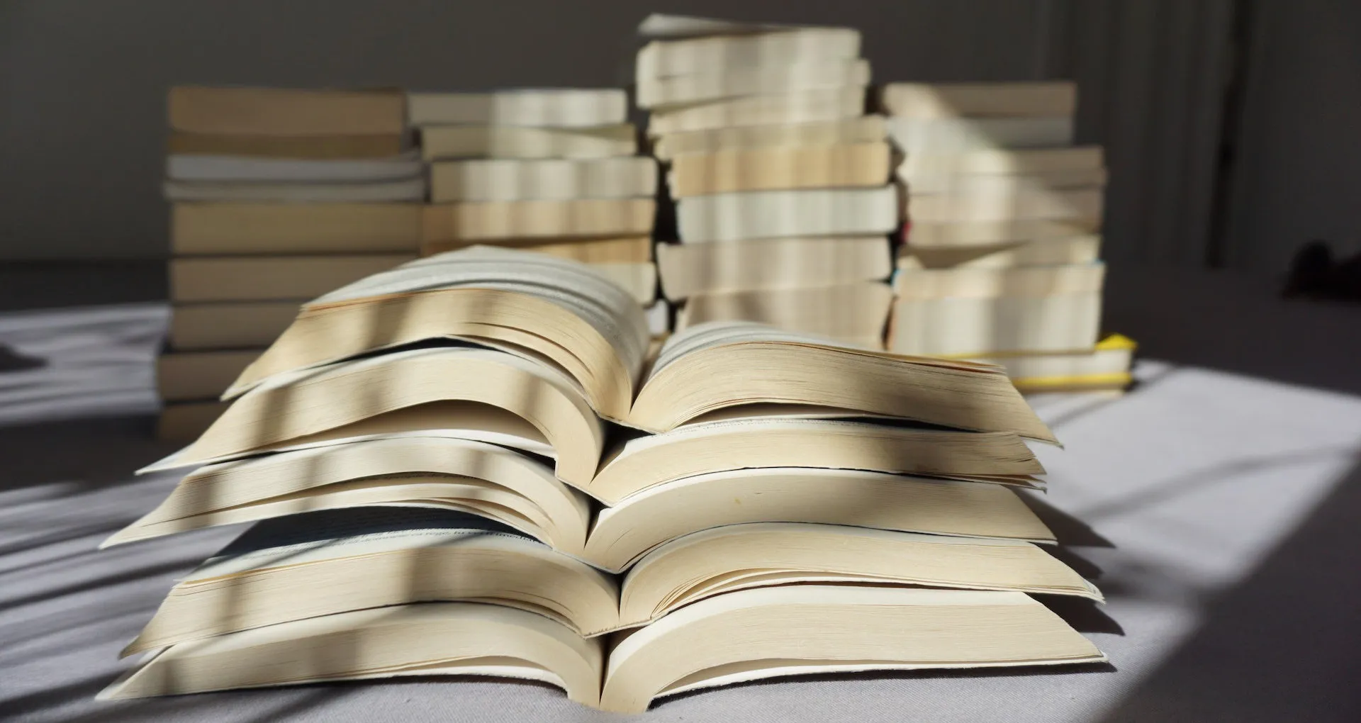 Stacked open books