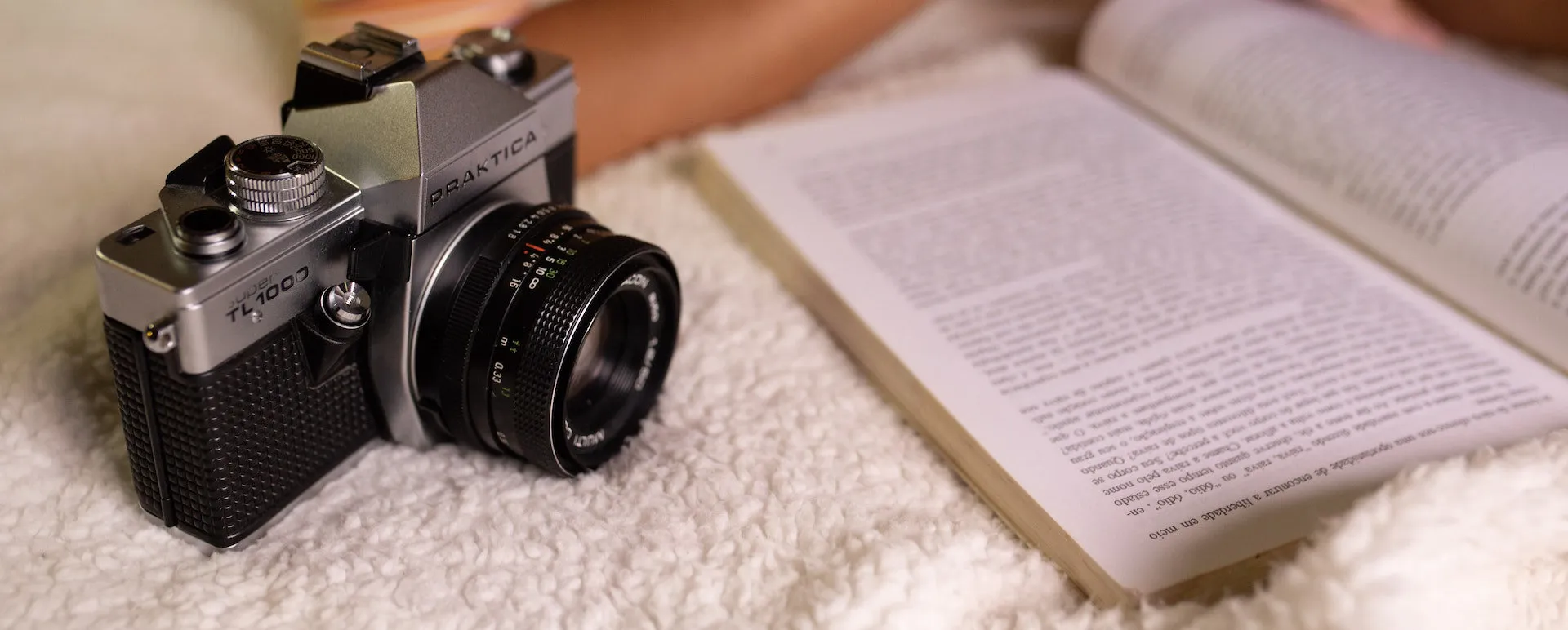 A camera and an open book