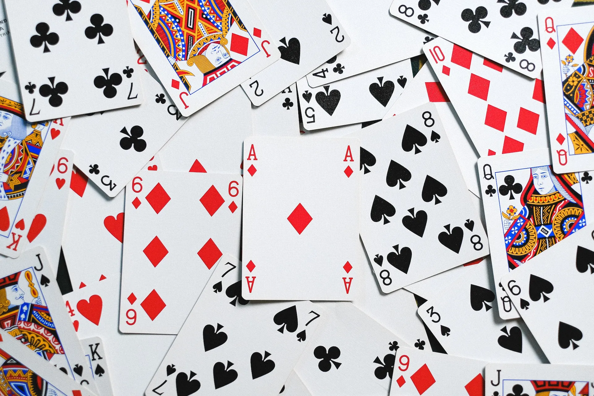 Random playing cards scattered on a table