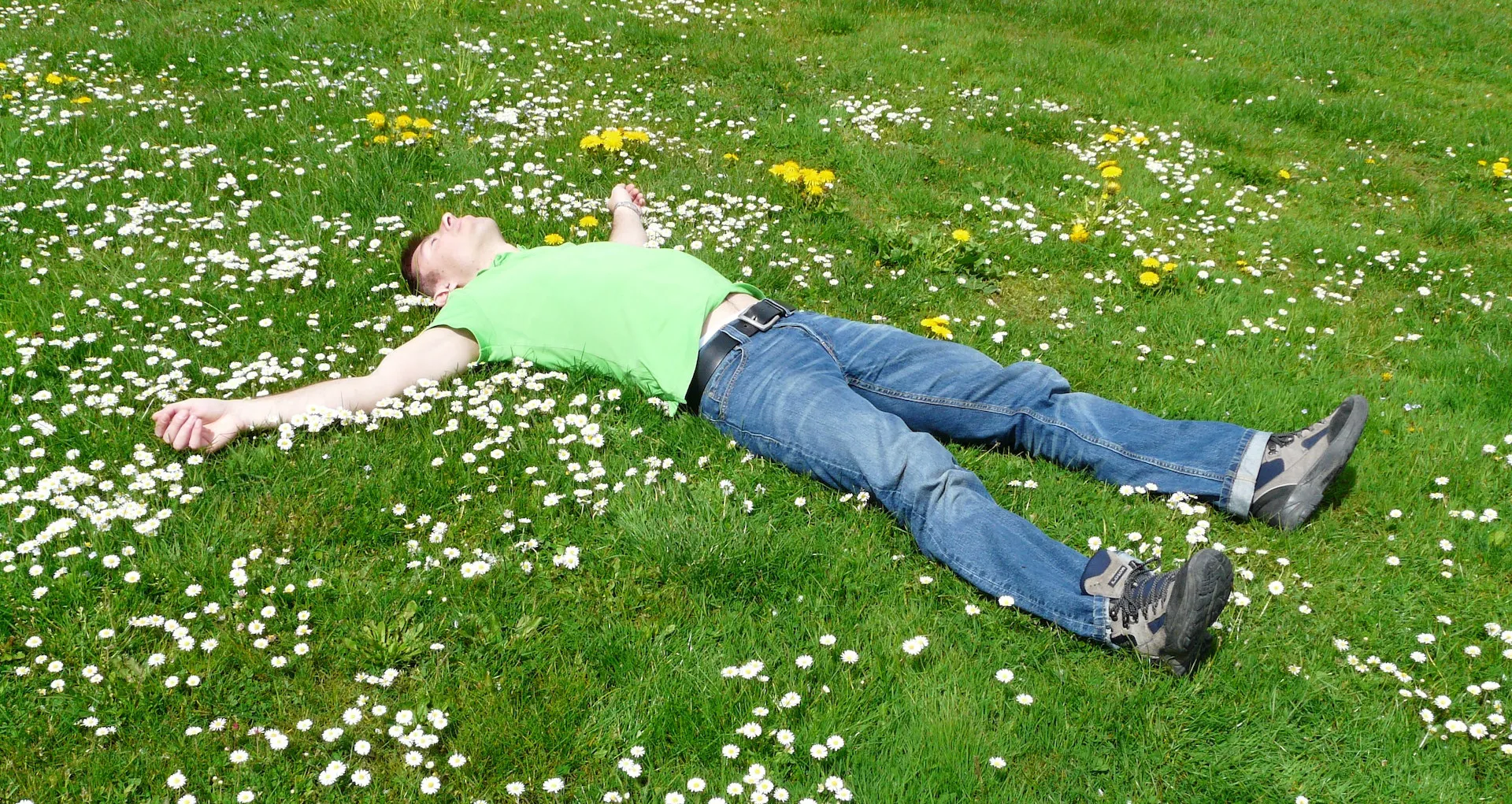 A person resting in the grass